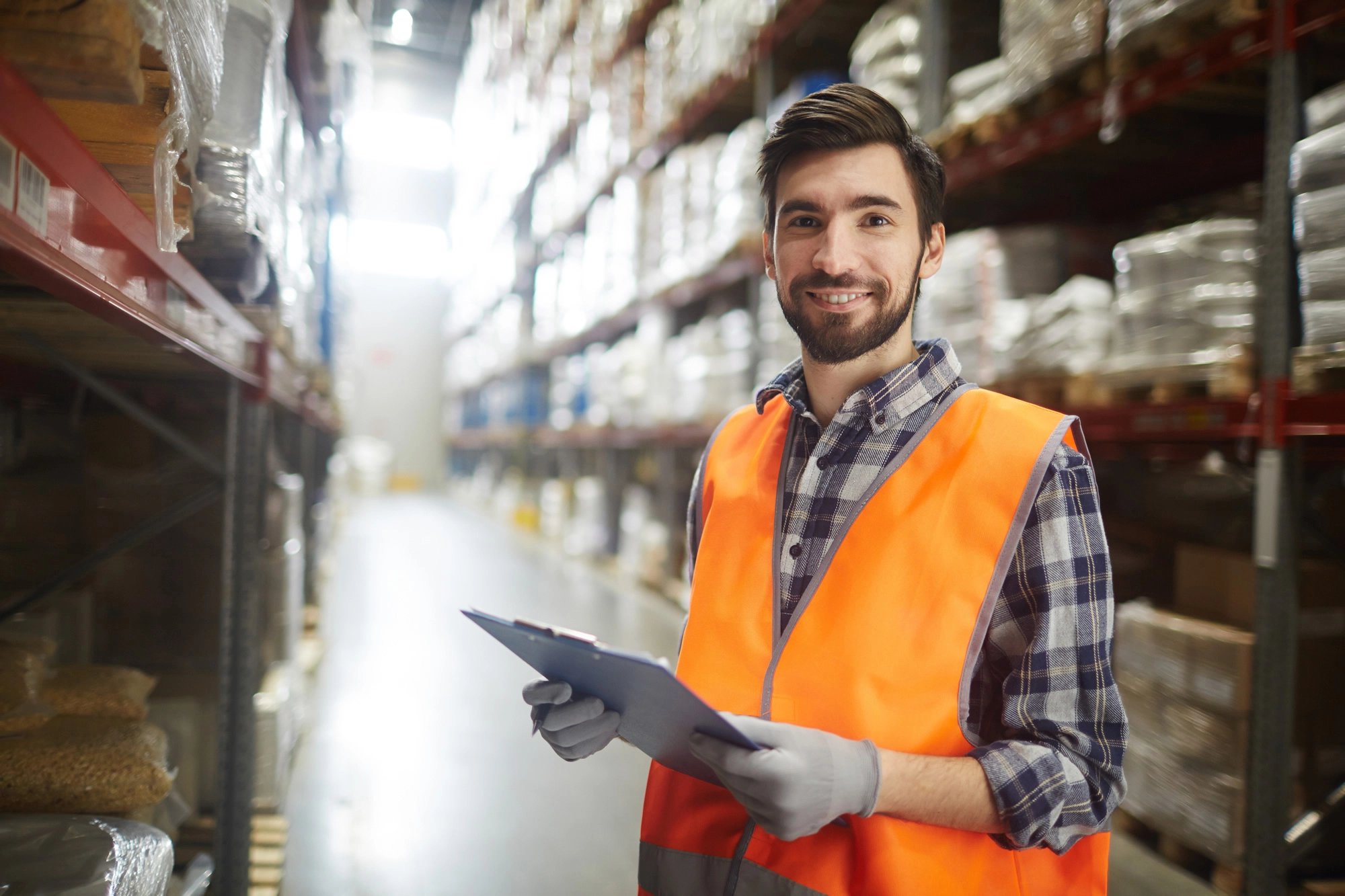 Warehouse working conducting a manual handling risk assessment