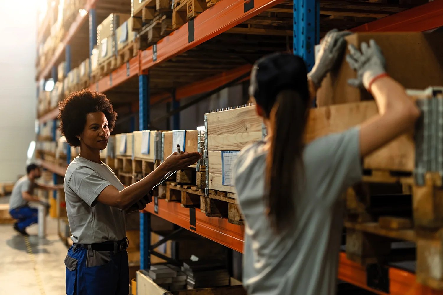 Manual Handling - Two people working in warehouse