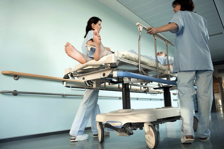 Nurses Moving Patient on gurne