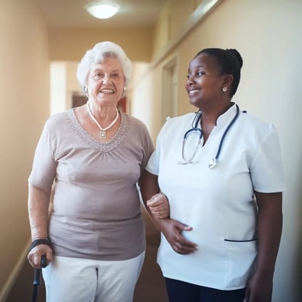 Nurse supporting elderly patient