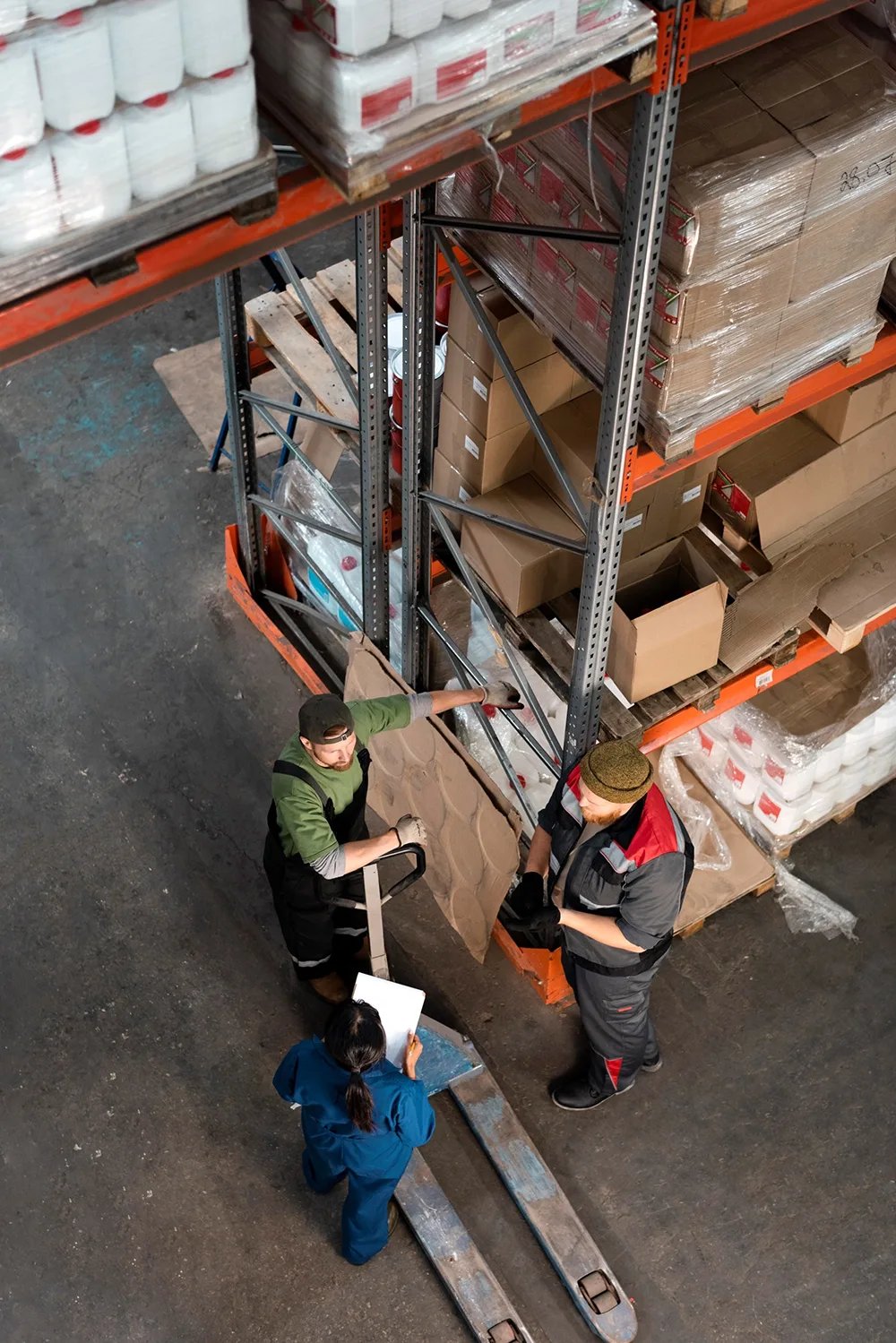 People working together Manual Handling in warehouse