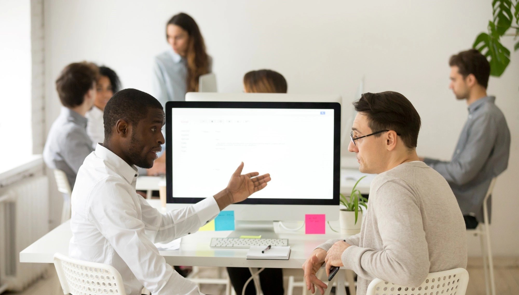 serious-multiracial-colleagues-having-discussion-brainstorming-project-together-office