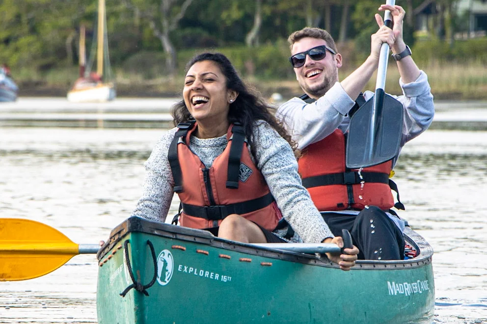 A couple enjoying a canoeing session on the River Spey