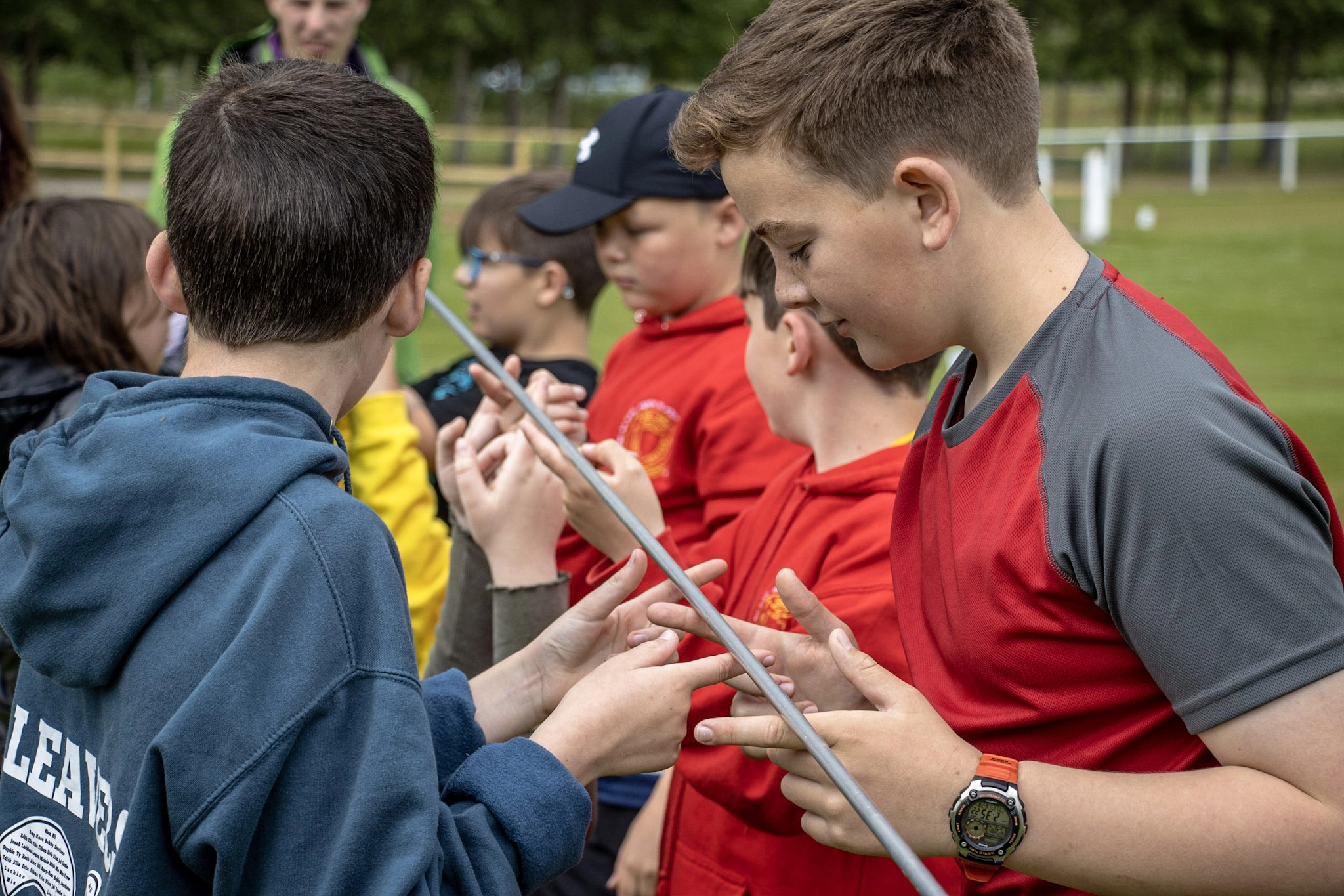Pupils taking part in team challenge activities on a residential