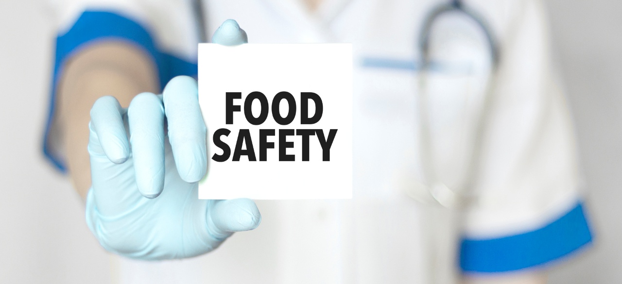 Doctor holding a card with text food safety