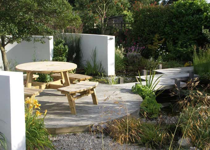 Contemporary garden design with outdoor dining area in Canterbury Kent