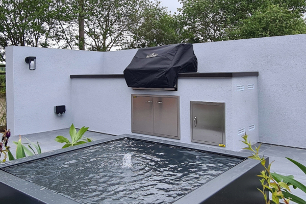contemporary outdoor kitchen with water feature