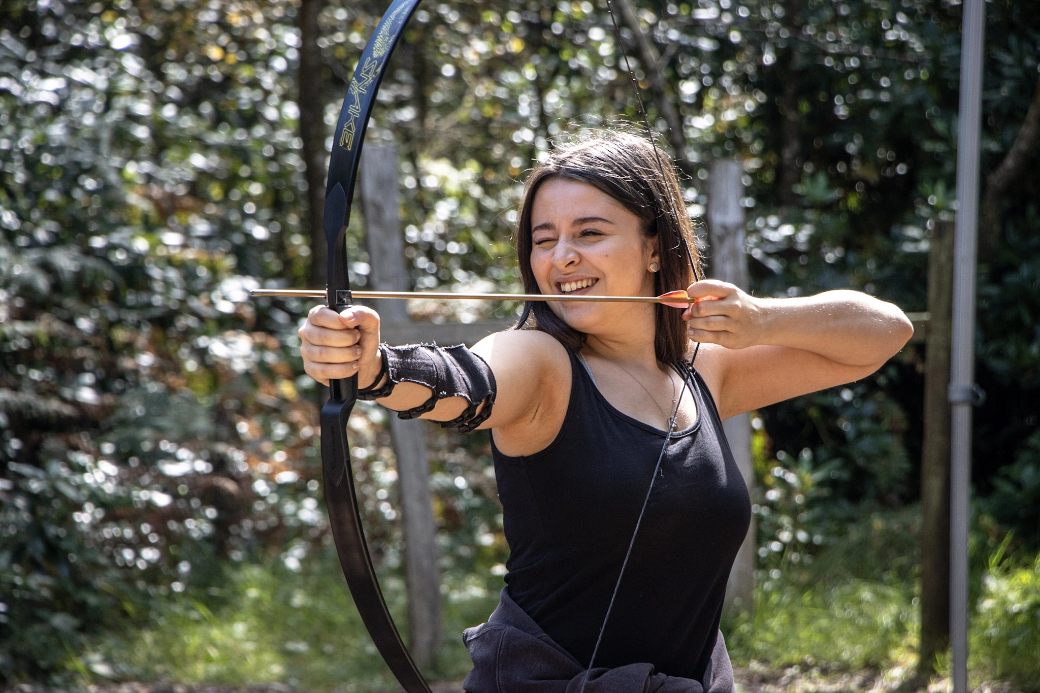 A participant taking part in an archery session in the New Forest.