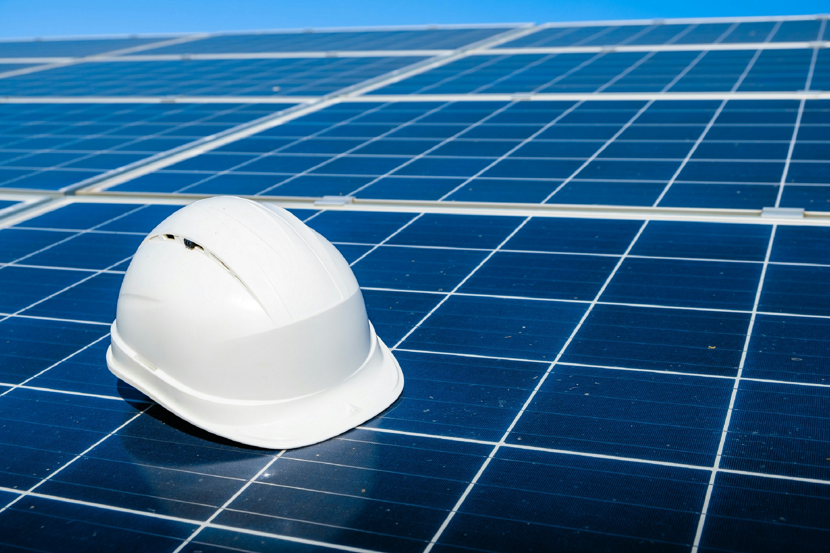 Hard hat on solar panel