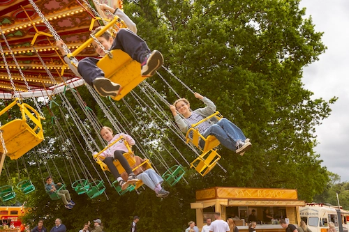Horton's Steam Fair traditional chair-o-planes in the Victorious Festival Family Area, Southsea Common