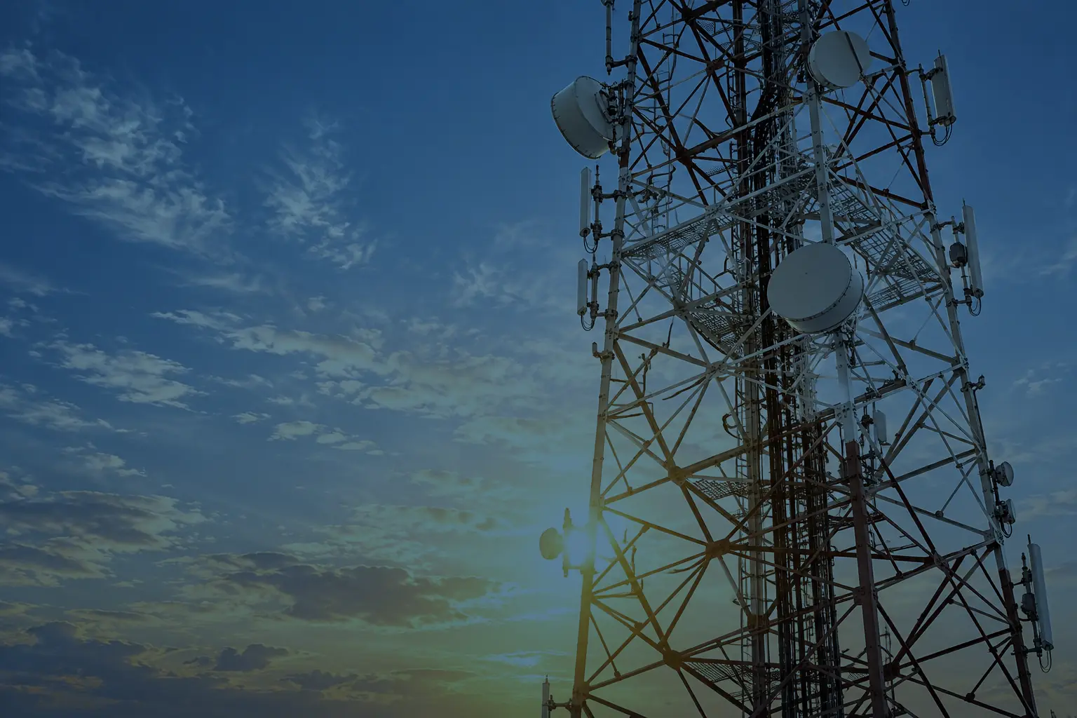 Telecoms mast against a pale sky