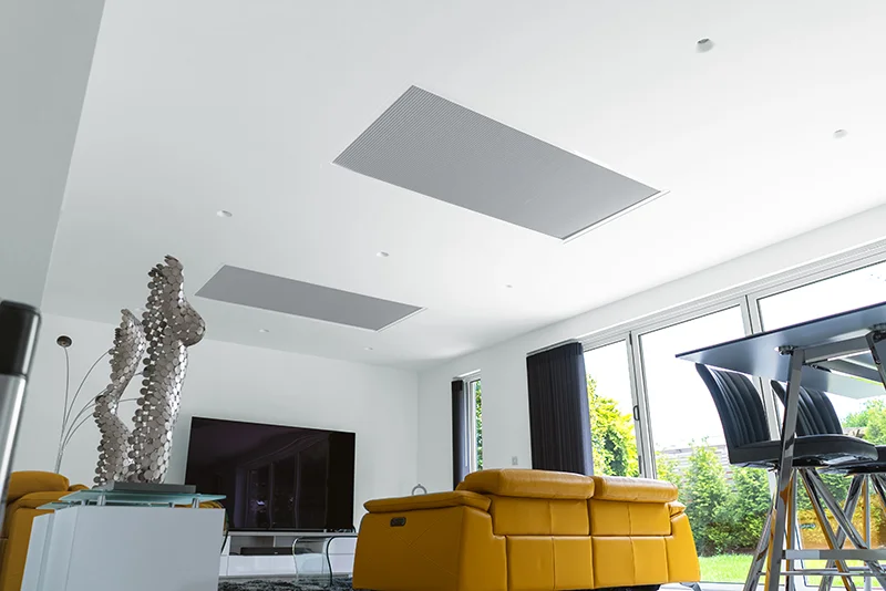 Modern living room with recessed ceiling blinds and yellow sofa.