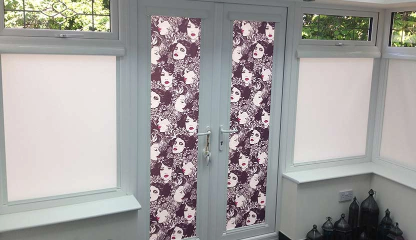 Doors with a unique face-patterned design, adding colour to a new home.