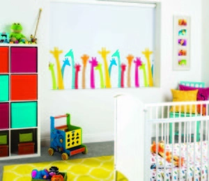 Colourful kids' room with giraffe window border and white crib.