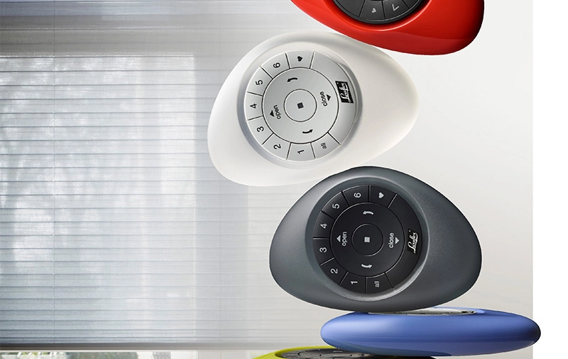Colorful Leha blind remote controls in white, gray, red, blue, and yellow. 