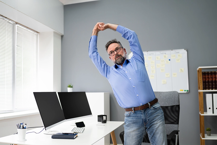 bigstock-Stretching-Office-Workout-Des-394548926