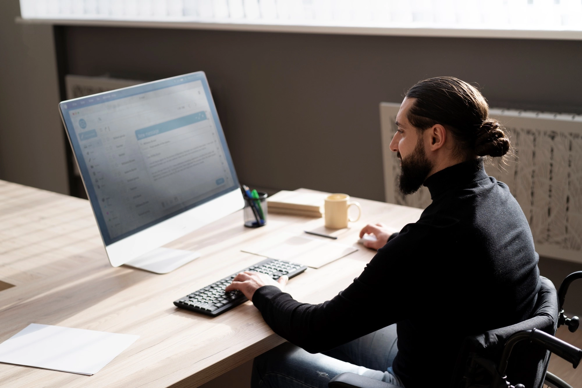 medium-shot-disabled-man-working-desk