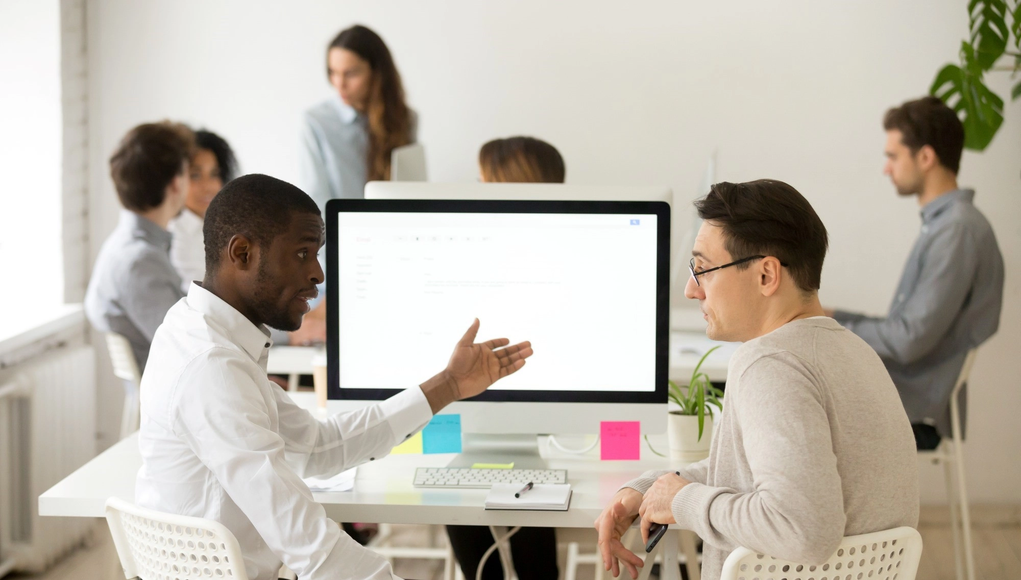 serious-multiracial-colleagues-having-discussion-brainstorming-project-together-office
